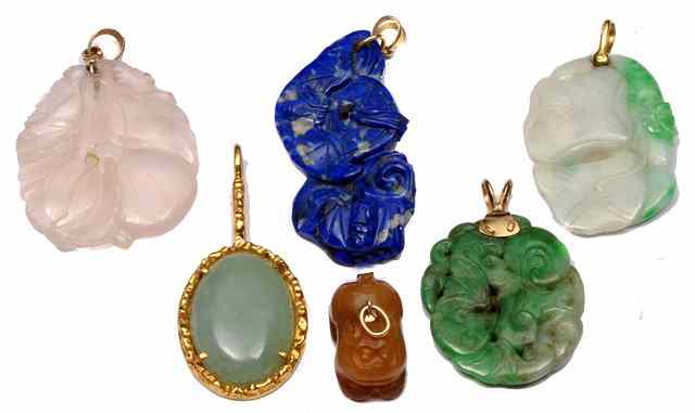 Appraisal: A JADE CHARM in the form of a rabbit two