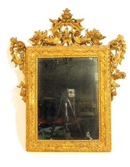 Appraisal: Continental giltwood wall mirror th century The rectangular mirror plate