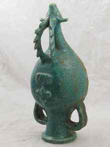 Appraisal: An Islamic probably Kashan stoneware funnel the mythical beast and