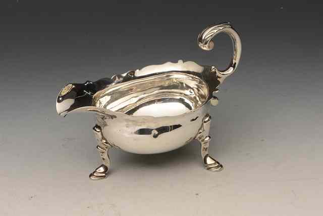 Appraisal: A GEORGE II SILVER SAUCE BOAT with wavy edge double