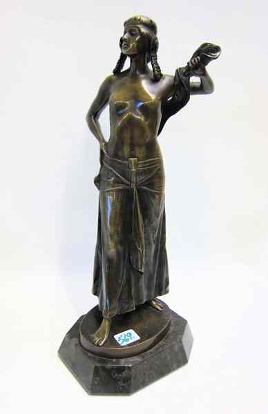 Appraisal: BRONZE FIGURE OF WOMAN STANDING bare chested bare footed holding