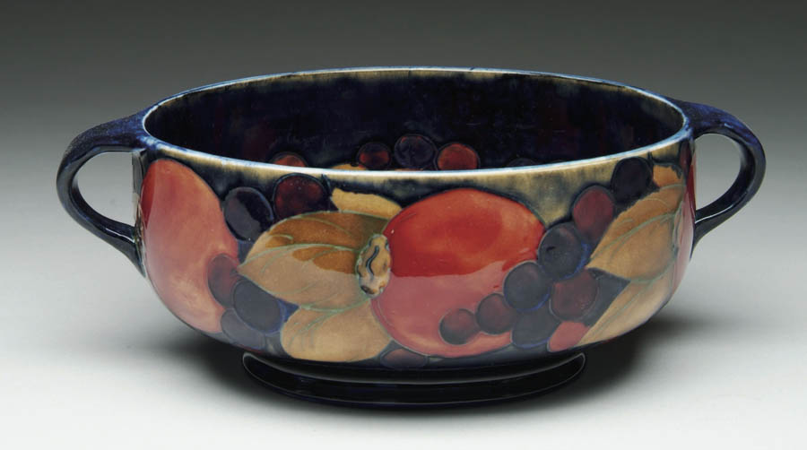 Appraisal: MOORCROFT HANDLED BOWL Wonderful Moorcroft pottery bowl is decorated inside