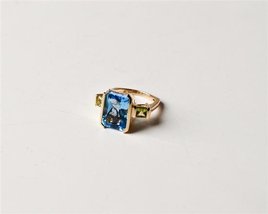 Appraisal: k Ring with Large Emerald-cut Blue Topaz Partially Bezel-set in