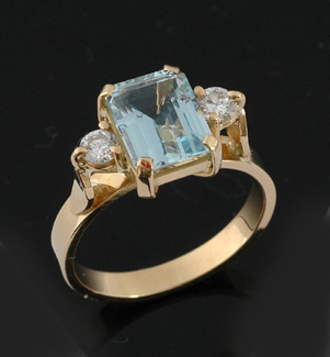 Appraisal: A three stone aquamarine and diamond ring The emerald cut