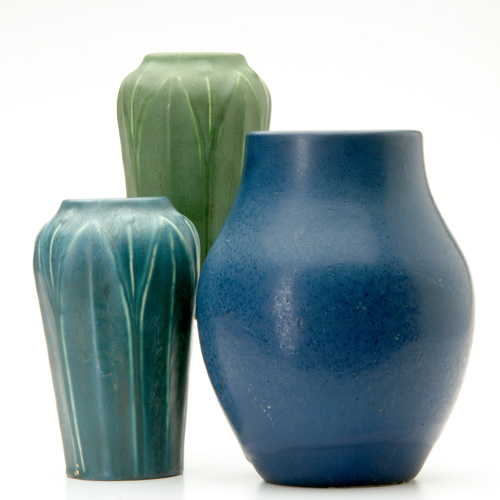 Appraisal: HAMPSHIRE Three vases two with tall leaves and buds one