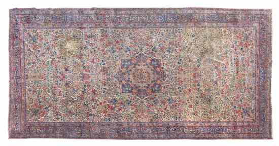 Appraisal: A Lavar Kirman Wool Rug having a stylized foliate center