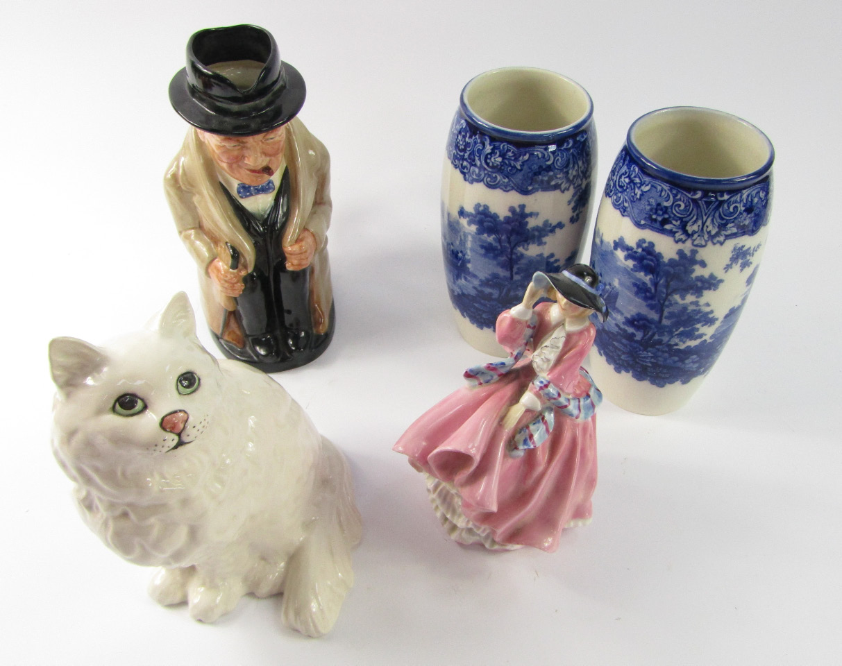 Appraisal: A Beswick cat Royal Doulton character jug modelled as Winston