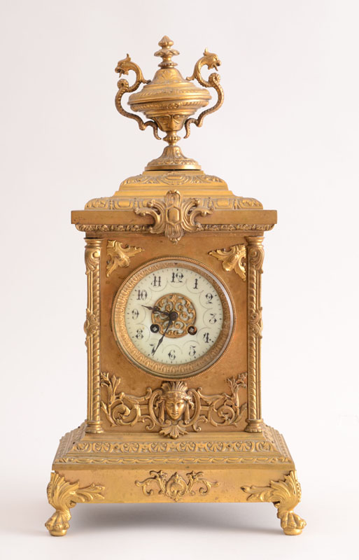 Appraisal: RENAISSANCE STYLE GILT-METAL MANTLE CLOCK The enamel dial within block