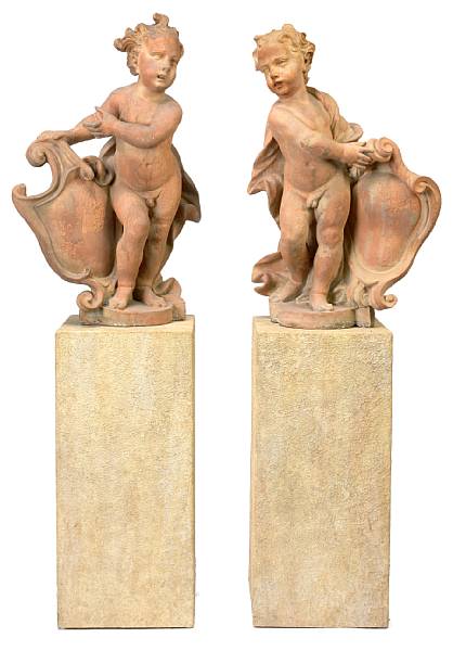 Appraisal: A pair of Continental terracotta figures of putti on pilasters