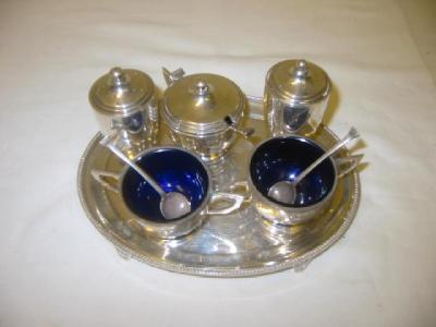 Appraisal: A FIVE PIECE CRUET SET of circular tapering form with