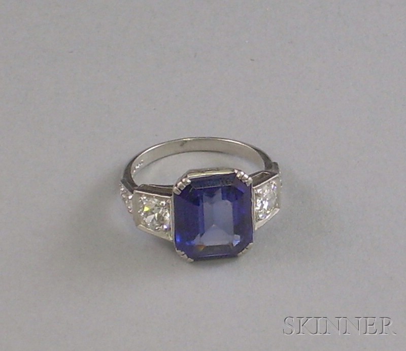 Appraisal: Platinum Synthetic Sapphire and Diamond Ring prong-set with an emerald-cut