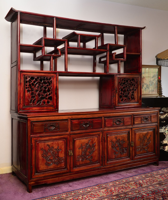 Appraisal: CHINESE CARVED ROSEWOOD ETAGERE DISPLAY CABINET Top with shaped pediment