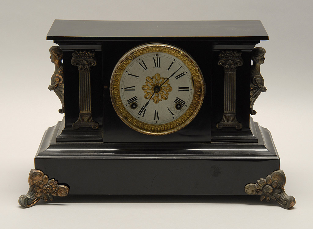 Appraisal: ANSONIA BLACK MARBLE SHELF CLOCK With gilt column-form decorations to