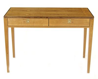 Appraisal: A two drawer desk the design attributed to Archie Shine