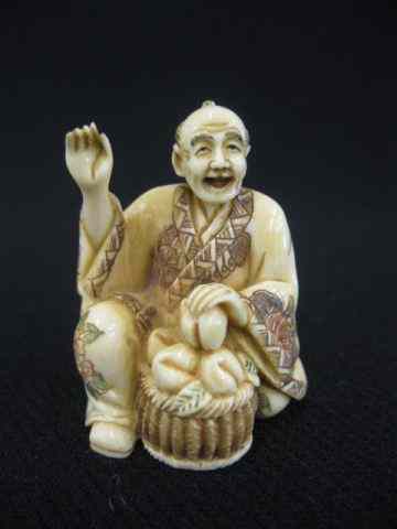 Appraisal: Carved Ivory Netsuke of a Seated Man with large basket