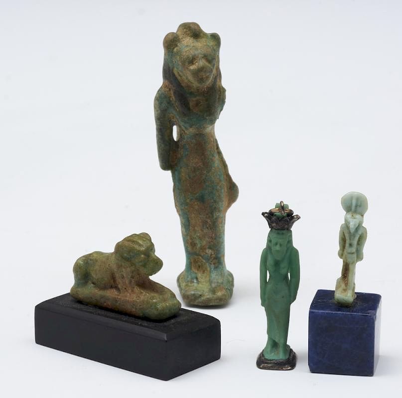 Appraisal: Four Egyptian blue faience amulet figures Four Egyptian blue faience