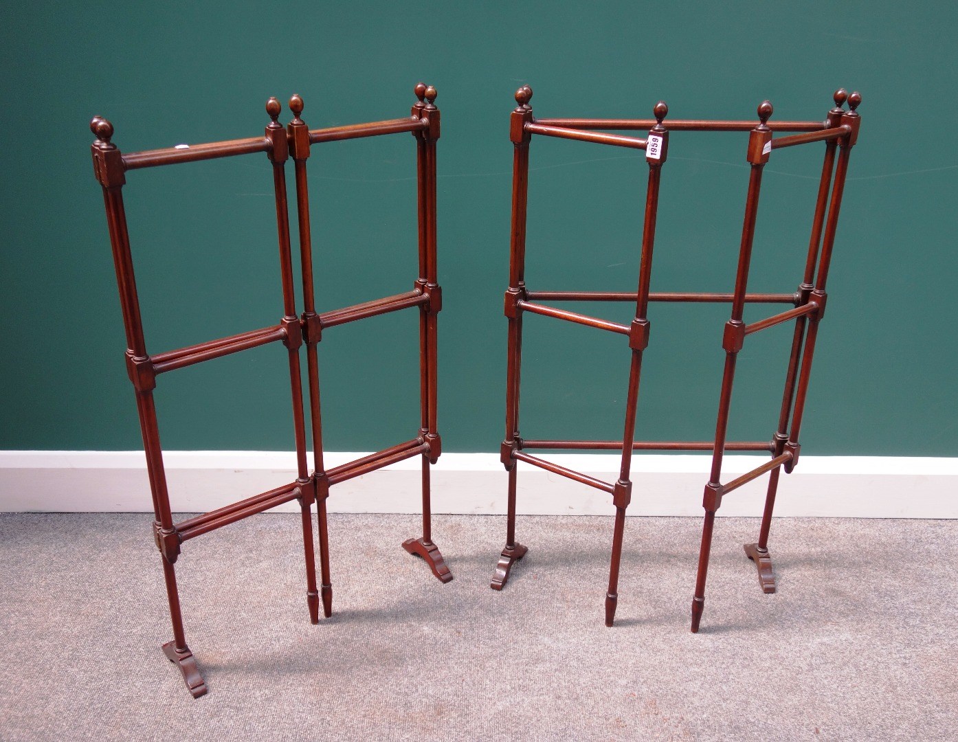 Appraisal: A pair of th century mahogany framed folding towel rails