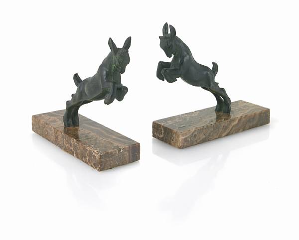 Appraisal: A pair of patinated bronze figural bookends cast after models