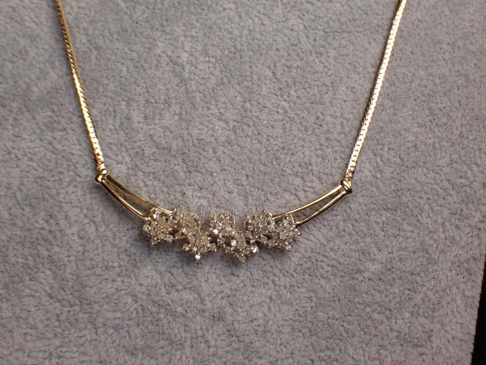 Appraisal: DIAMOND AND TWO-TONE GOLD NECKLACE The necklace with a length