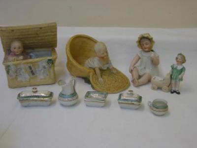 Appraisal: Three Continental bisque porcelain novelty baby items including two climbing