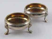 Appraisal: A pair of George II silver circular open salts circa