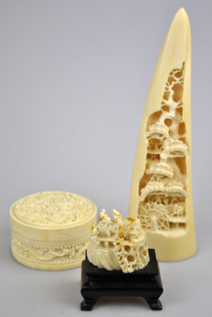 Appraisal: A Chinese ivory cylindrical box cover carved with dragons cm