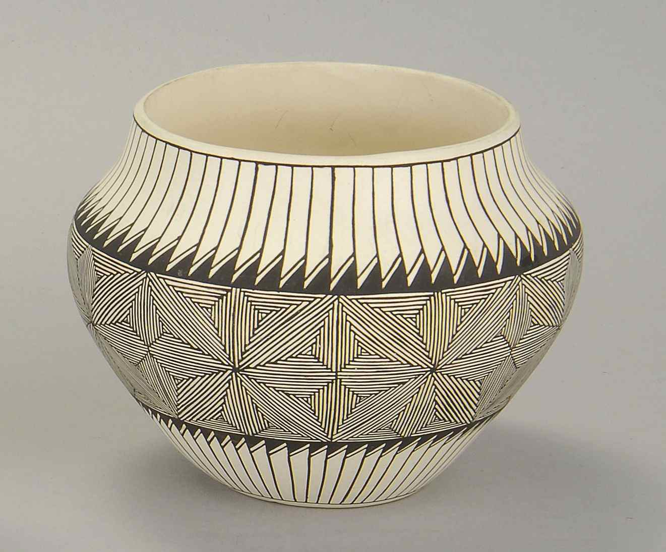 Appraisal: ACOMA POTTERY JAR th CenturyIn ovoid form with feather and