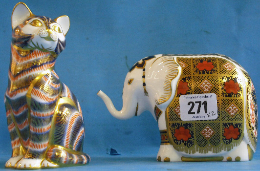 Appraisal: Royal Crown Derby Paperweights Elephant and Seated Cat silver stoppers