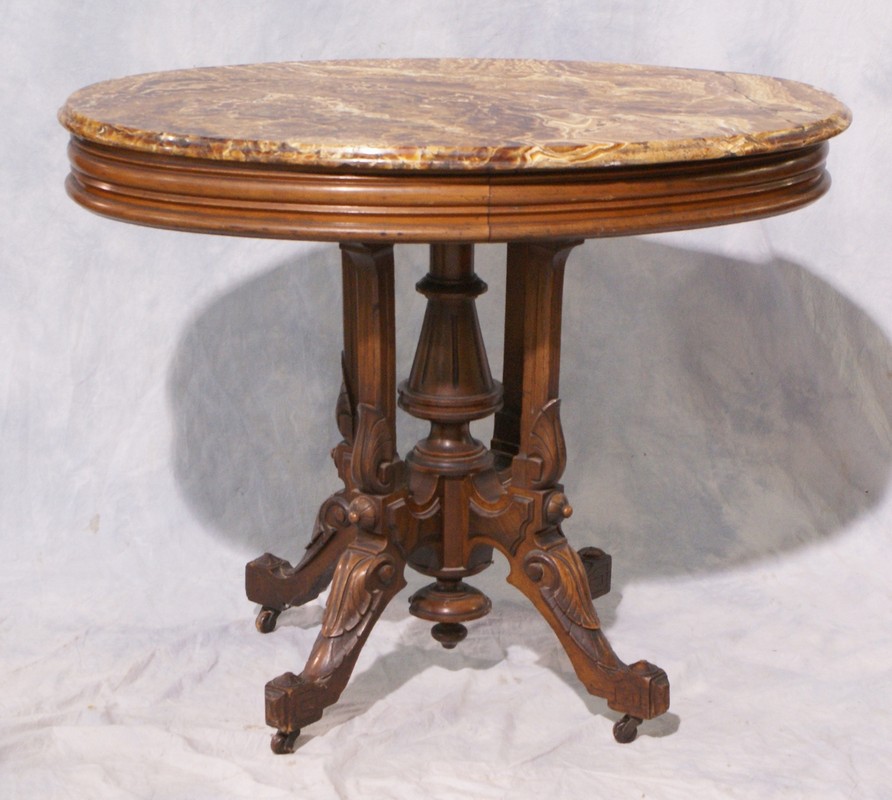 Appraisal: Oval Carved Walnut Victorian Renaissance Revival Marble Top Table brown