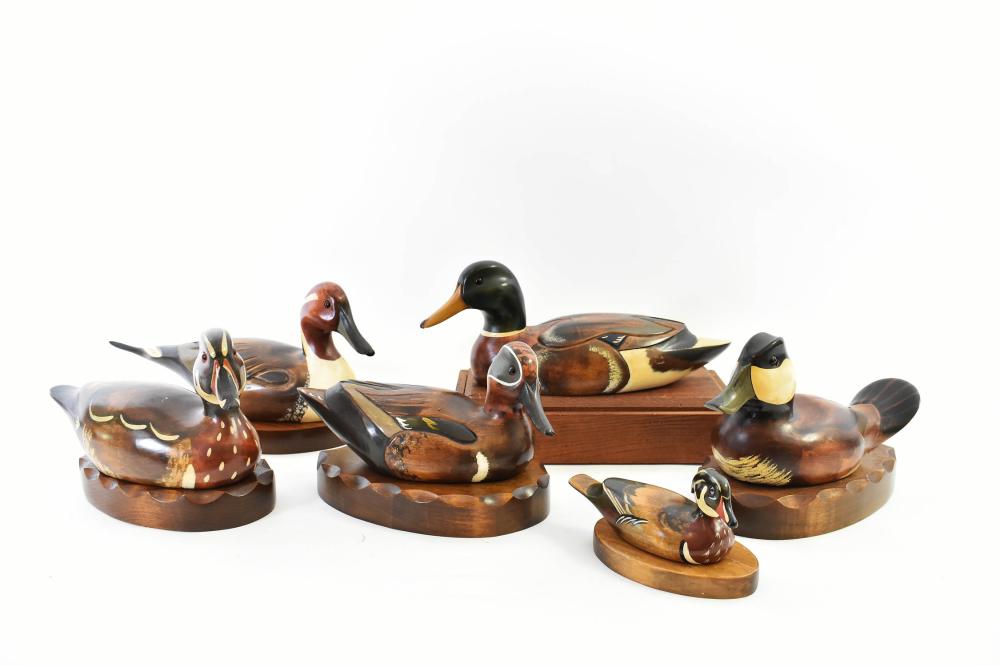 Appraisal: SEVEN PAINTED DUCK DECOYSAll branded with The Wooden Bird Factory