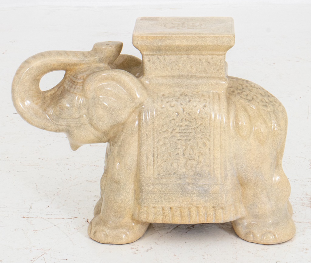 Appraisal: ELEPHANT CREAM CERAMIC STAND Off-white crackle glaze pottery of an