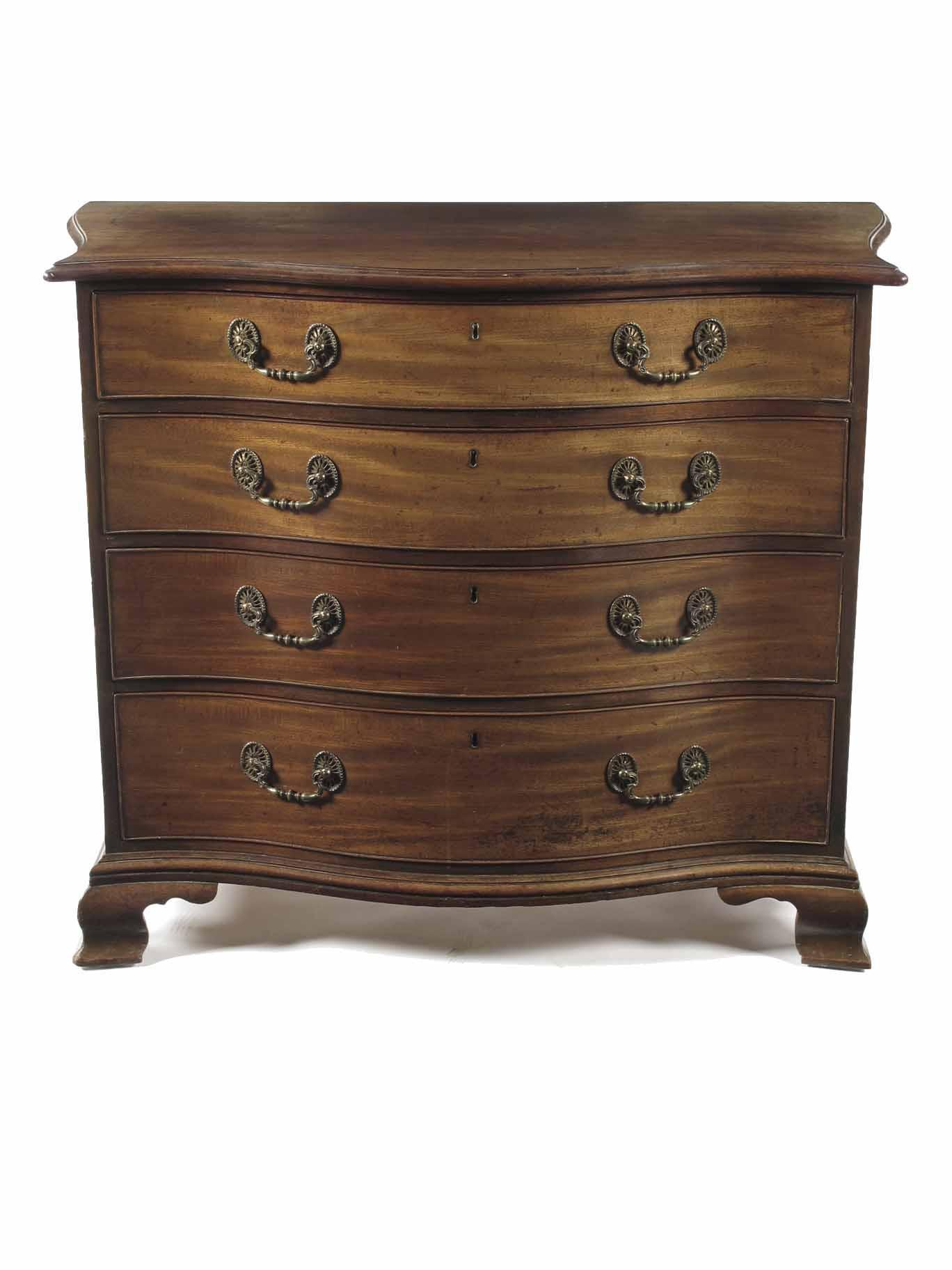 Appraisal: A late George III mahogany serpentine front commode