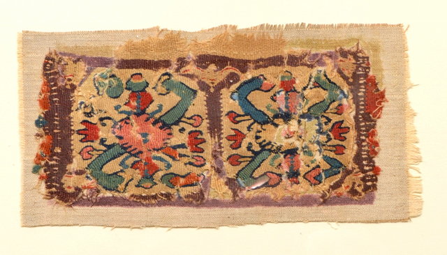 Appraisal: A RECTANGULAR TAPESTRY PANEL decorated with twin medallions of hooked