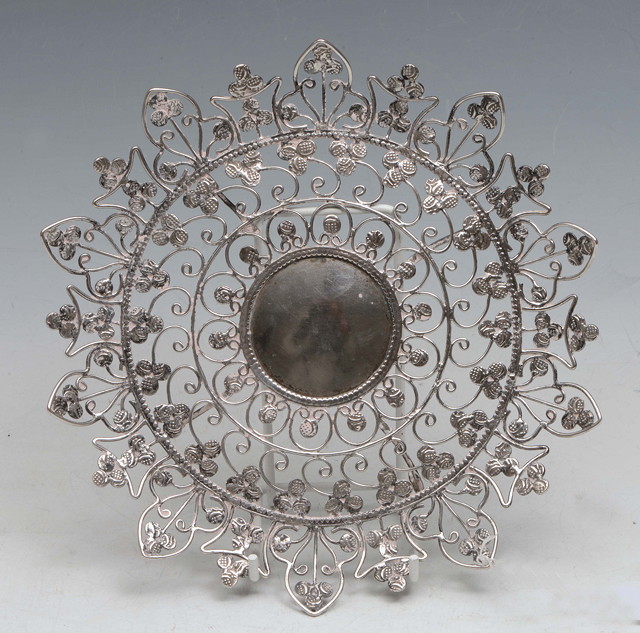 Appraisal: AN INDIAN WHITE METAL OPEN DISH of circular form with