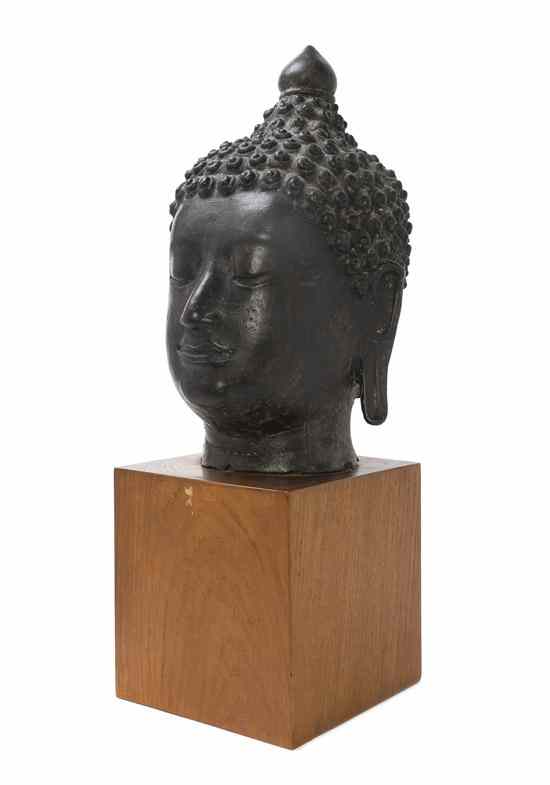 Appraisal: A Southeast Asian Bronze Model of the Head of Buddha