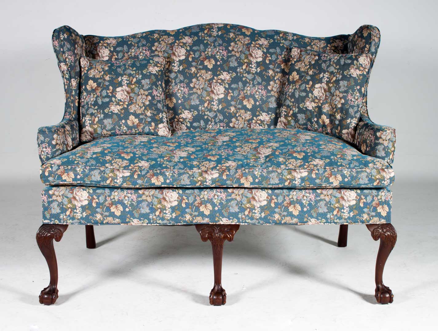 Appraisal: Chippendale style upholstered settee th century shaped crest rail winged