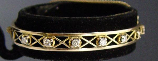 Appraisal: K GOLD BANGLE BRACELET WITH DIAMONDS K yellow gold hinged