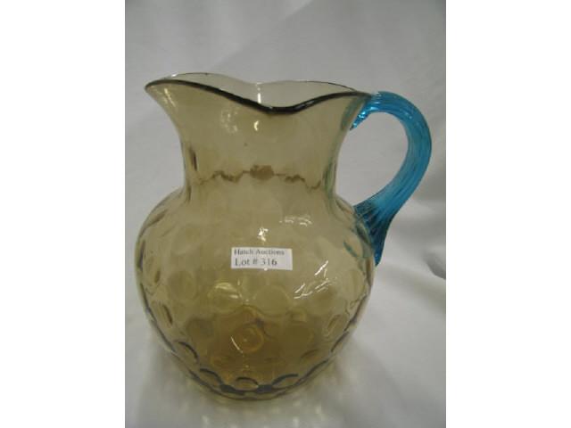 Appraisal: Victorian Art Glass Pitcher thumbprint design amber with rich blue