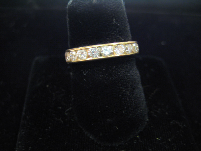 Appraisal: DIAMOND WEDDING RING k yellow gold band with eleven channel