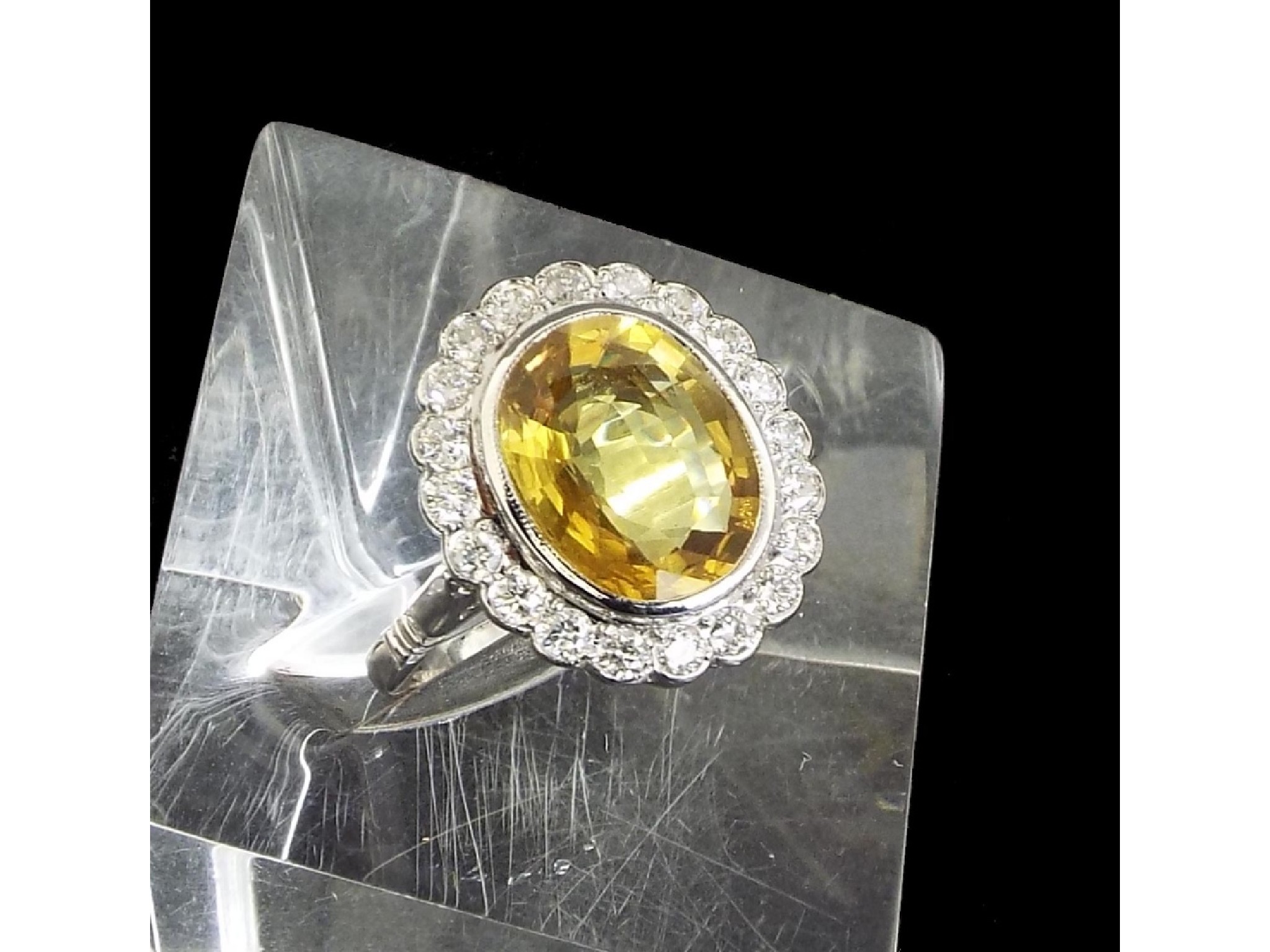 Appraisal: Large fancy yellow sapphire and diamond oval cluster ring in