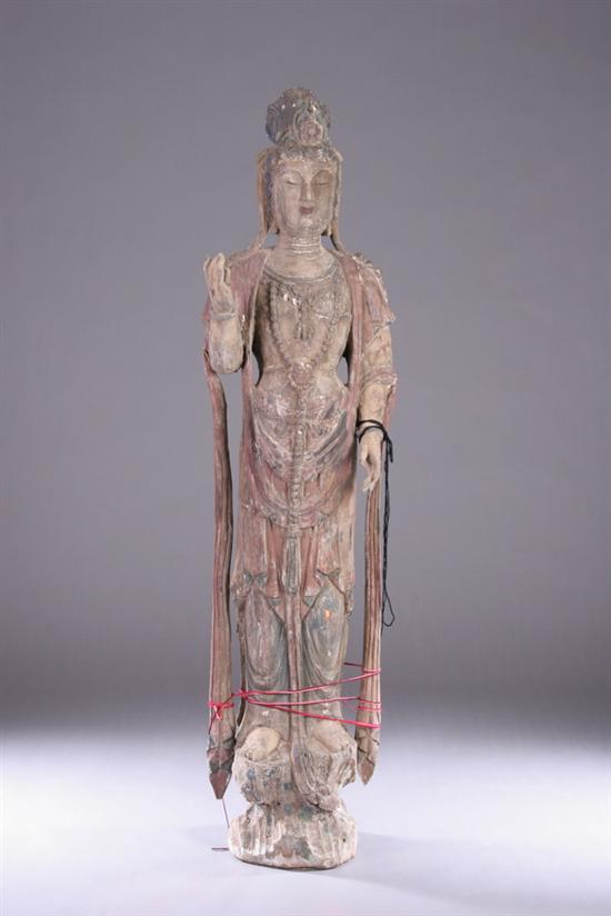 Appraisal: CHINESE POLYCHROME WOOD FIGURE OF GUANYIN Wei dynasty or later