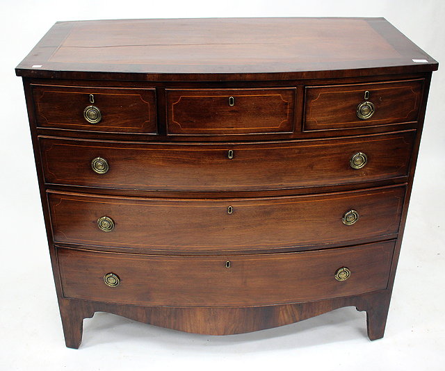 Appraisal: A VICTORIAN MAHOGANY BOW FRONT CHEST of two short and