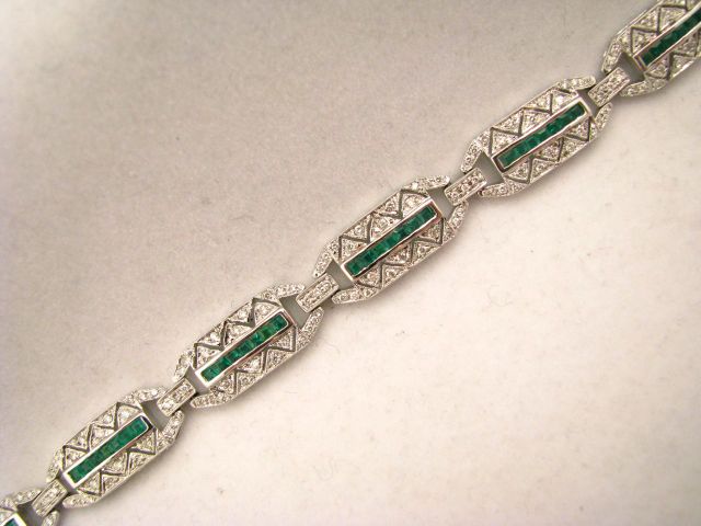 Appraisal: k white gold diamond and emerald bracelet long Channel set