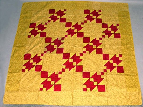 Appraisal: Quilt Red geometric appliques on yellow ground Early th century