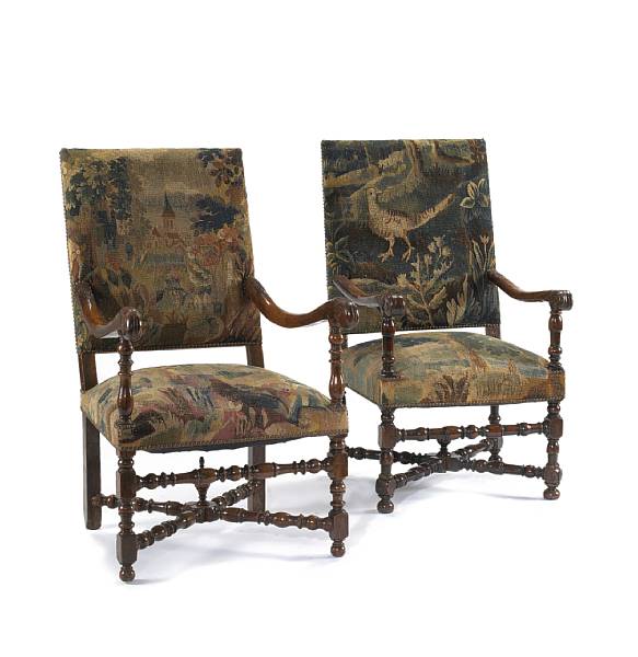 Appraisal: An assembled pair of Louis XIV walnut and tapestry upholstered