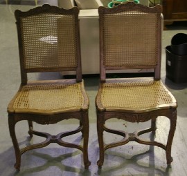 Appraisal: A pair of carved stained beech and caned occassional chairs