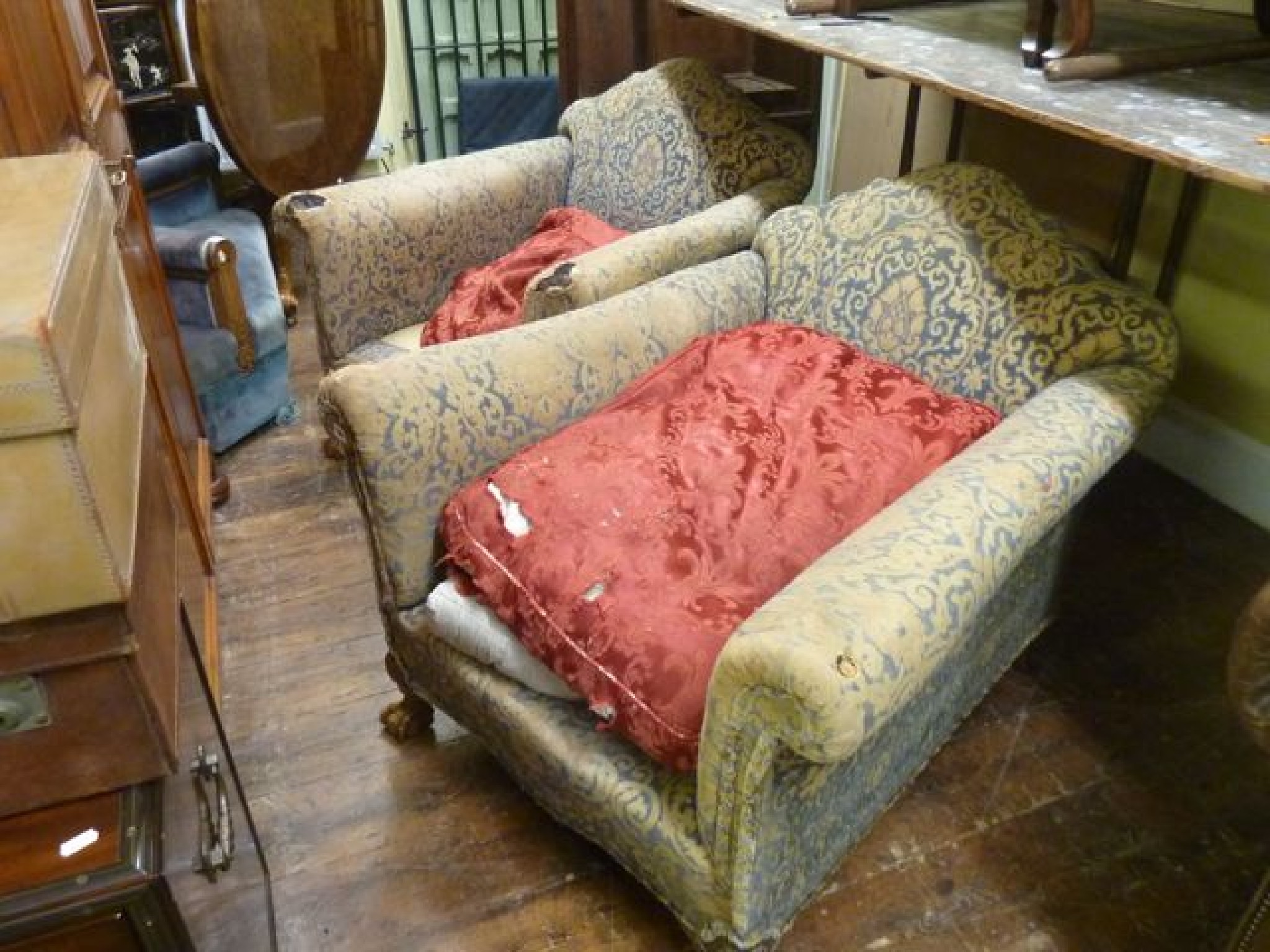 Appraisal: A pair of substantial Edwardian drawing room chairs with very