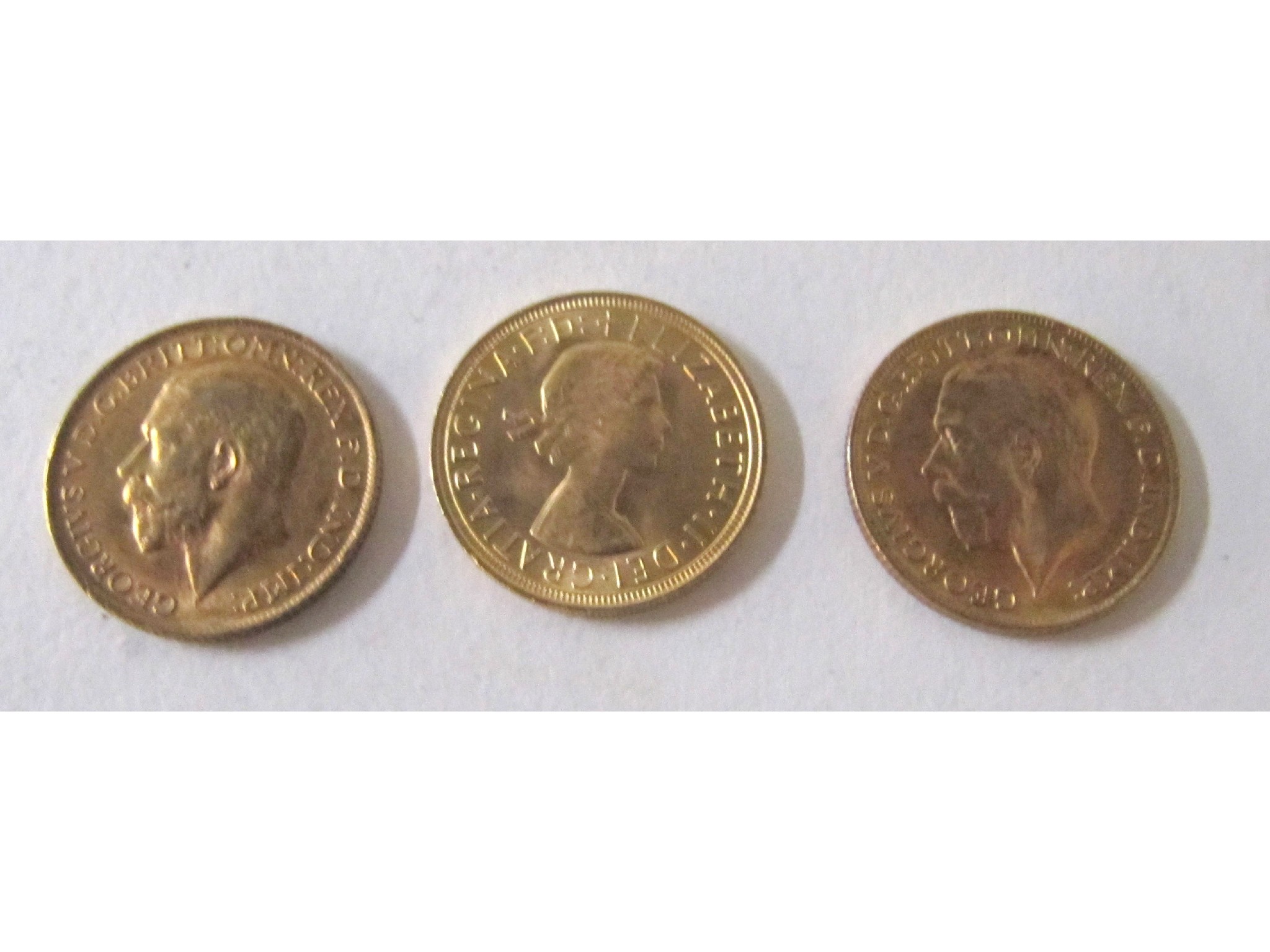 Appraisal: Three gold sovereigns George V nice very fine George V