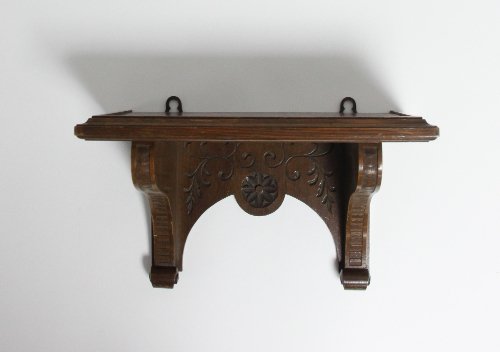 Appraisal: An Edwardian carved oak clock bracket cm wide