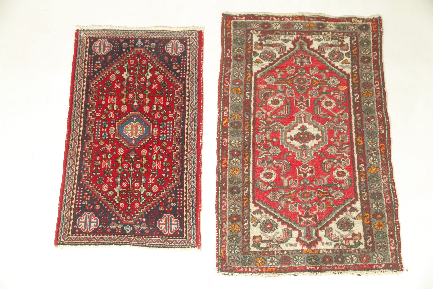 Appraisal: TWO ORIENTAL RUGS Mid th century Red grounds Abadeh '